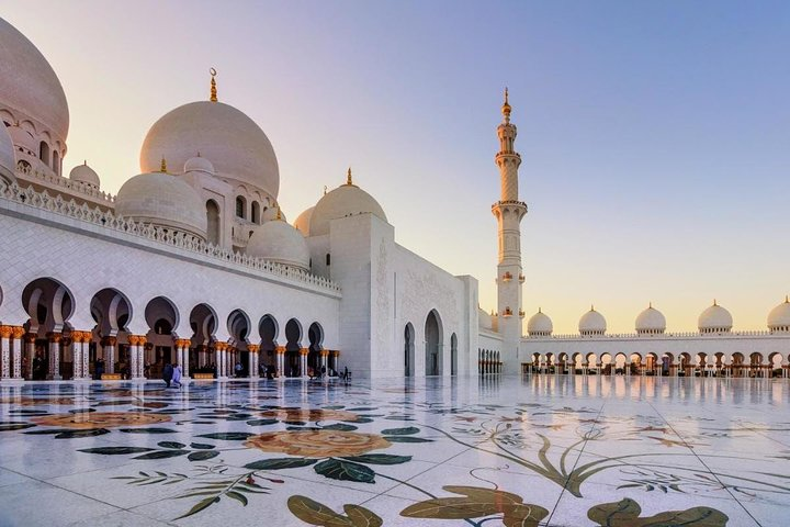 Explore the stunning architecture of the Sheikh Zayed Grand Mosque with its intricate designs and peaceful surroundings a highlight of the Abu Dhabi City Tour.